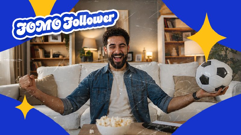 A man, smiling and cheering, holds a soccer ball in a cozy living room with a bowl of popcorn in front. The colorful "FOMO Follower" text overlays the image.